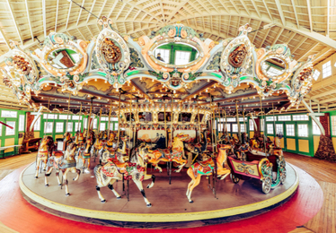carousel interior with colorful horses and other animals