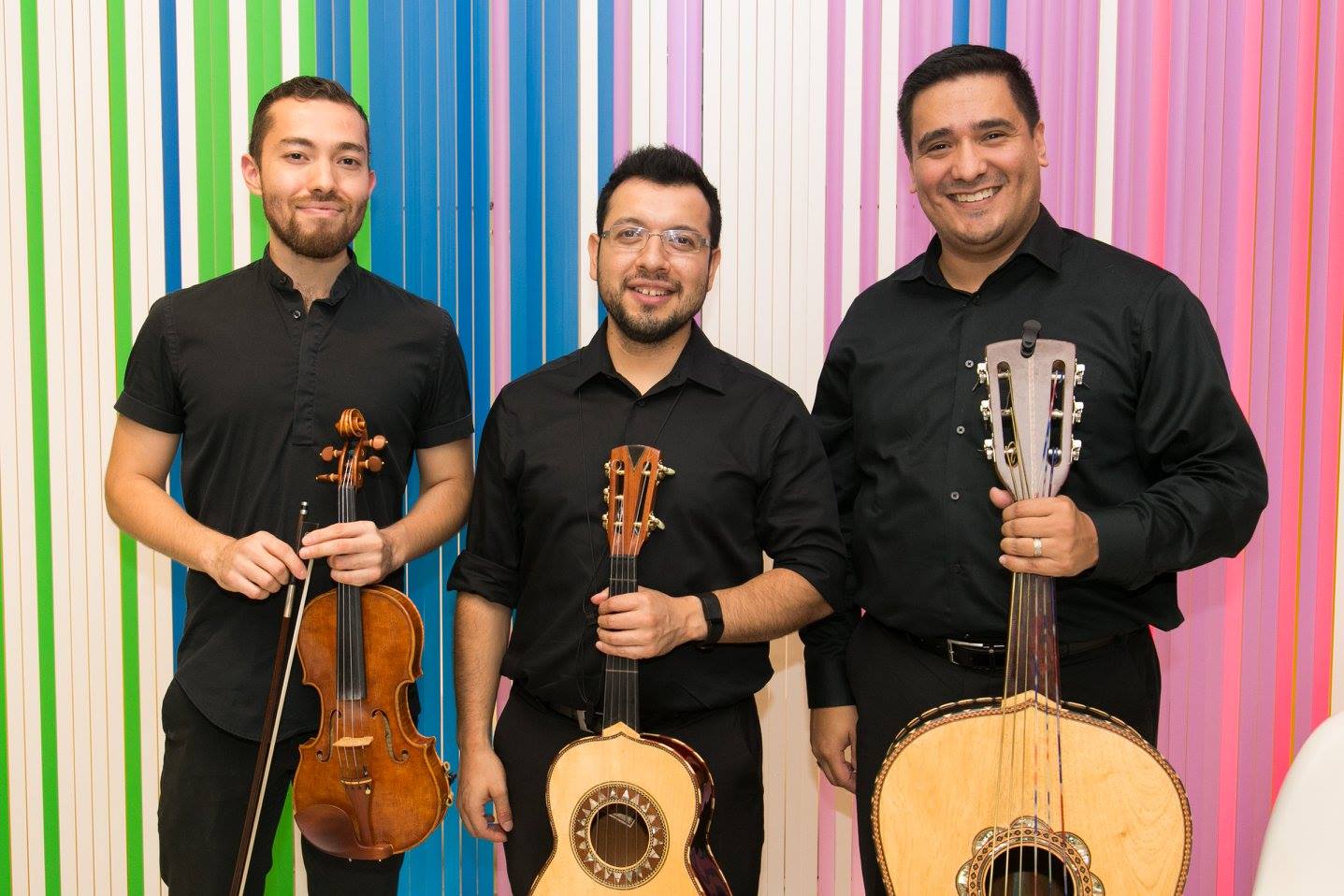 a band holds their instruments