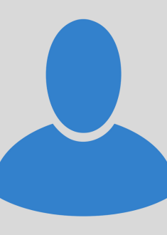 blue placeholder icon for a staff member without a photo. head and body of a generic person are reprsented by blue shapes.